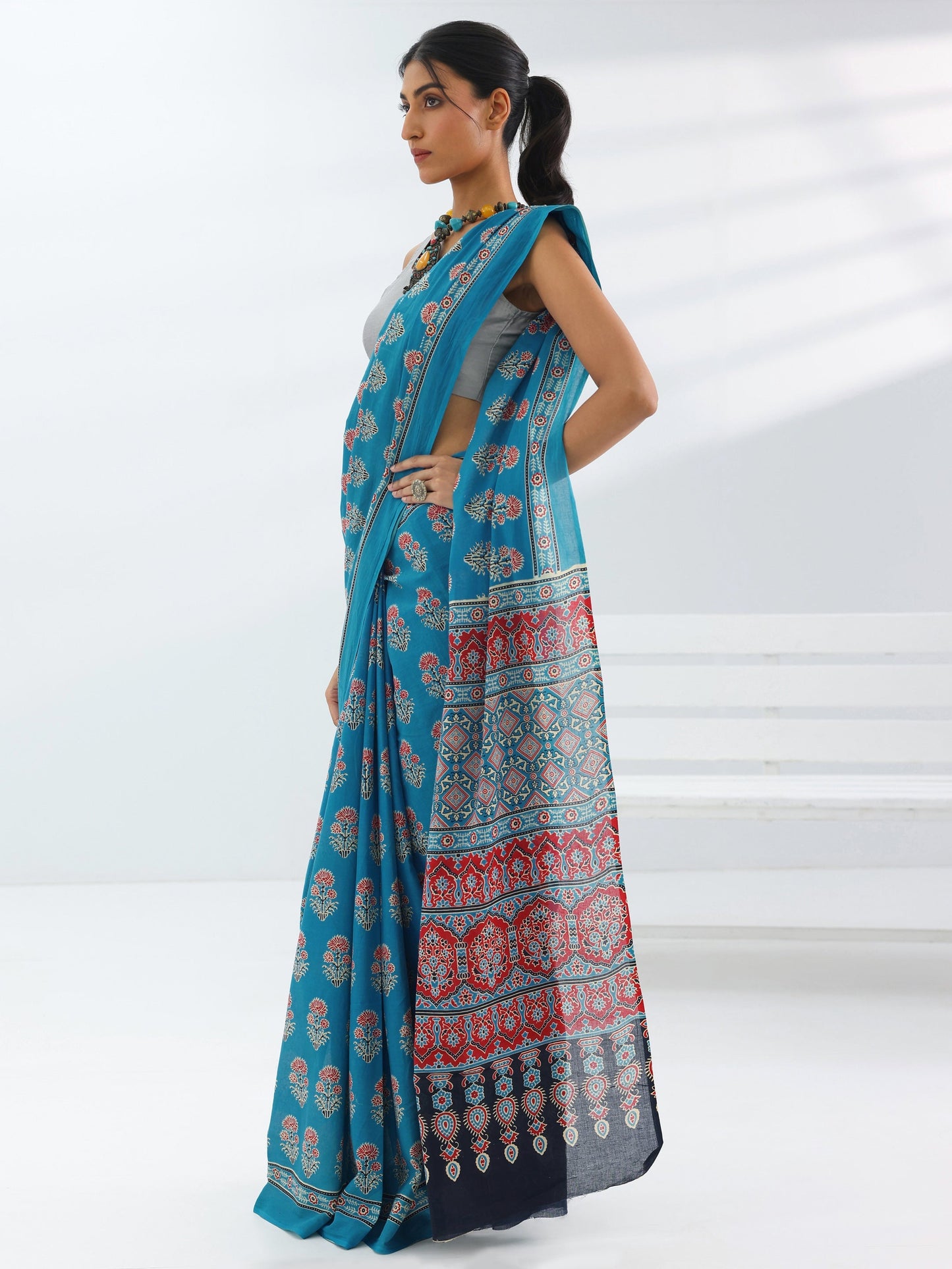 Turquoise Blue Printed Cotton Saree With Unstitched Blouse Piece