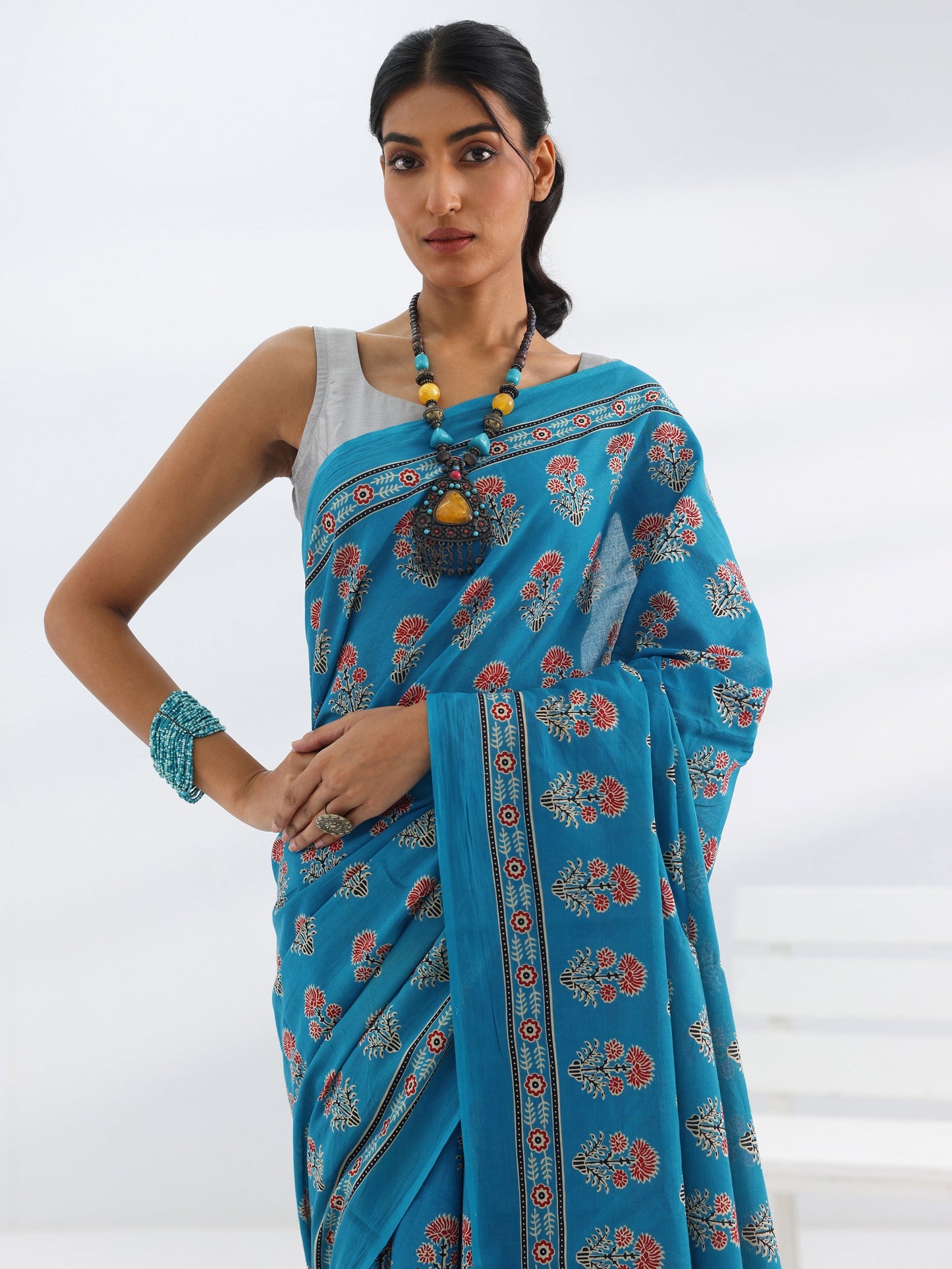 Turquoise Blue Printed Cotton Saree With Unstitched Blouse Piece