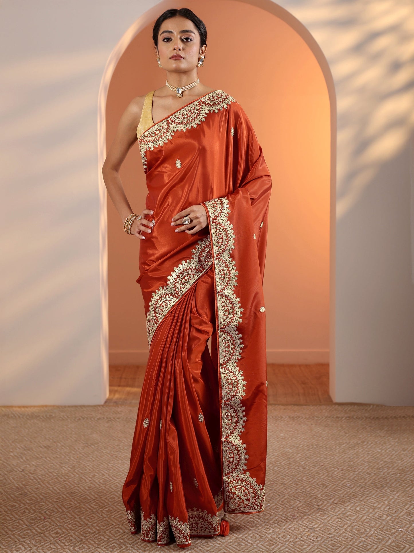 Rust Embellished Crepe Saree With Unstitched Blouse Piece