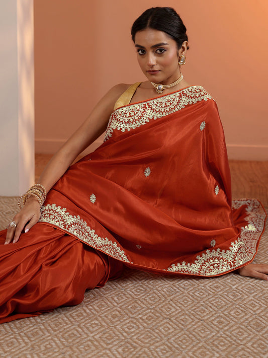 Rust Embellished Crepe Saree With Unstitched Blouse Piece