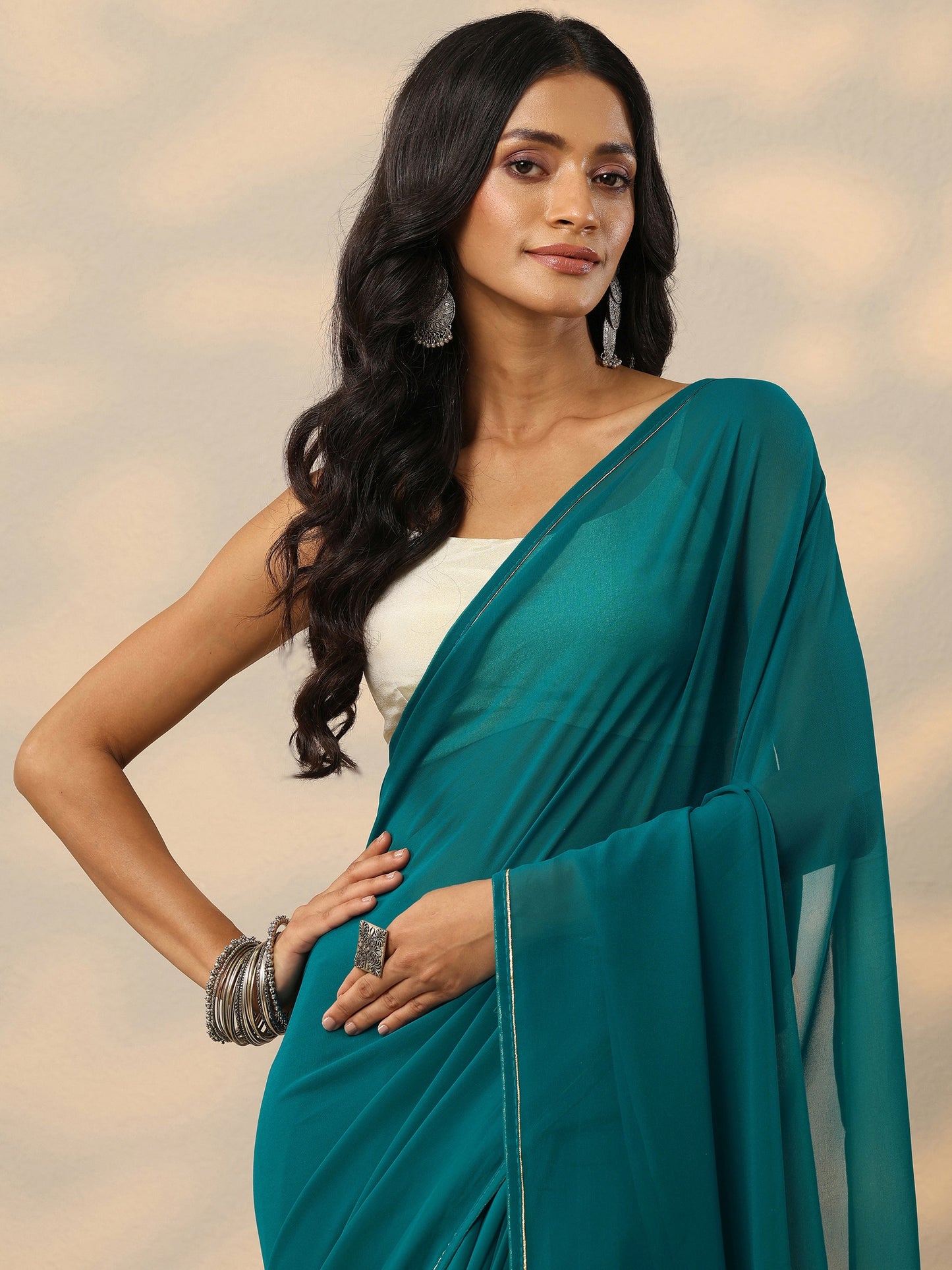 Teal Solid Georgette Saree With Unstitched Blouse Piece