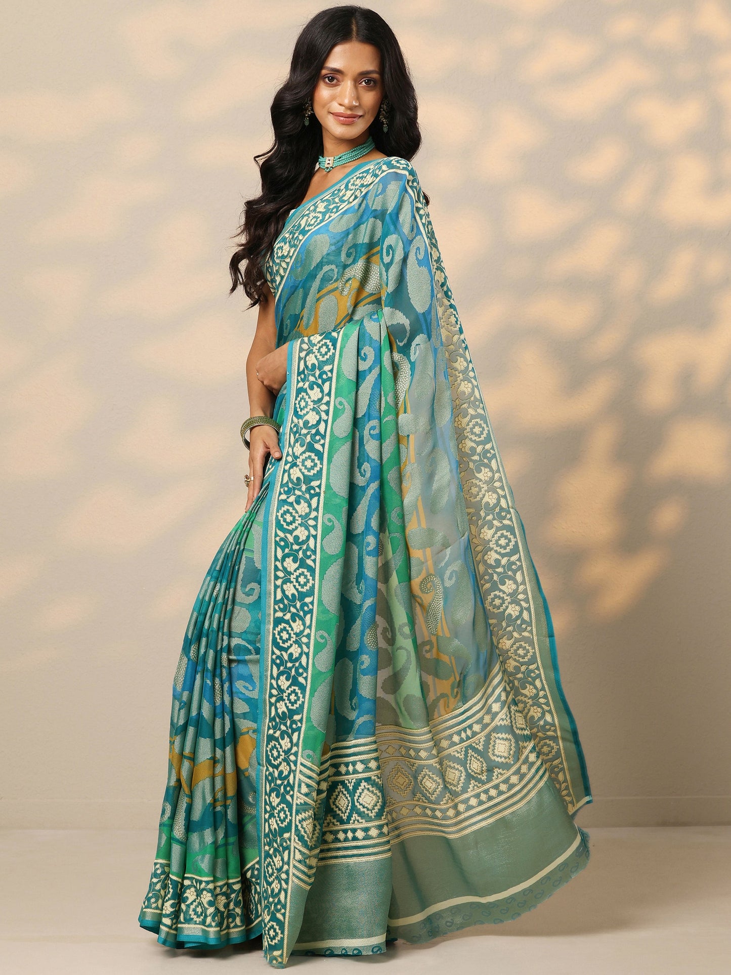 Teal Printed Georgette Saree With Unstitched Blouse Piece