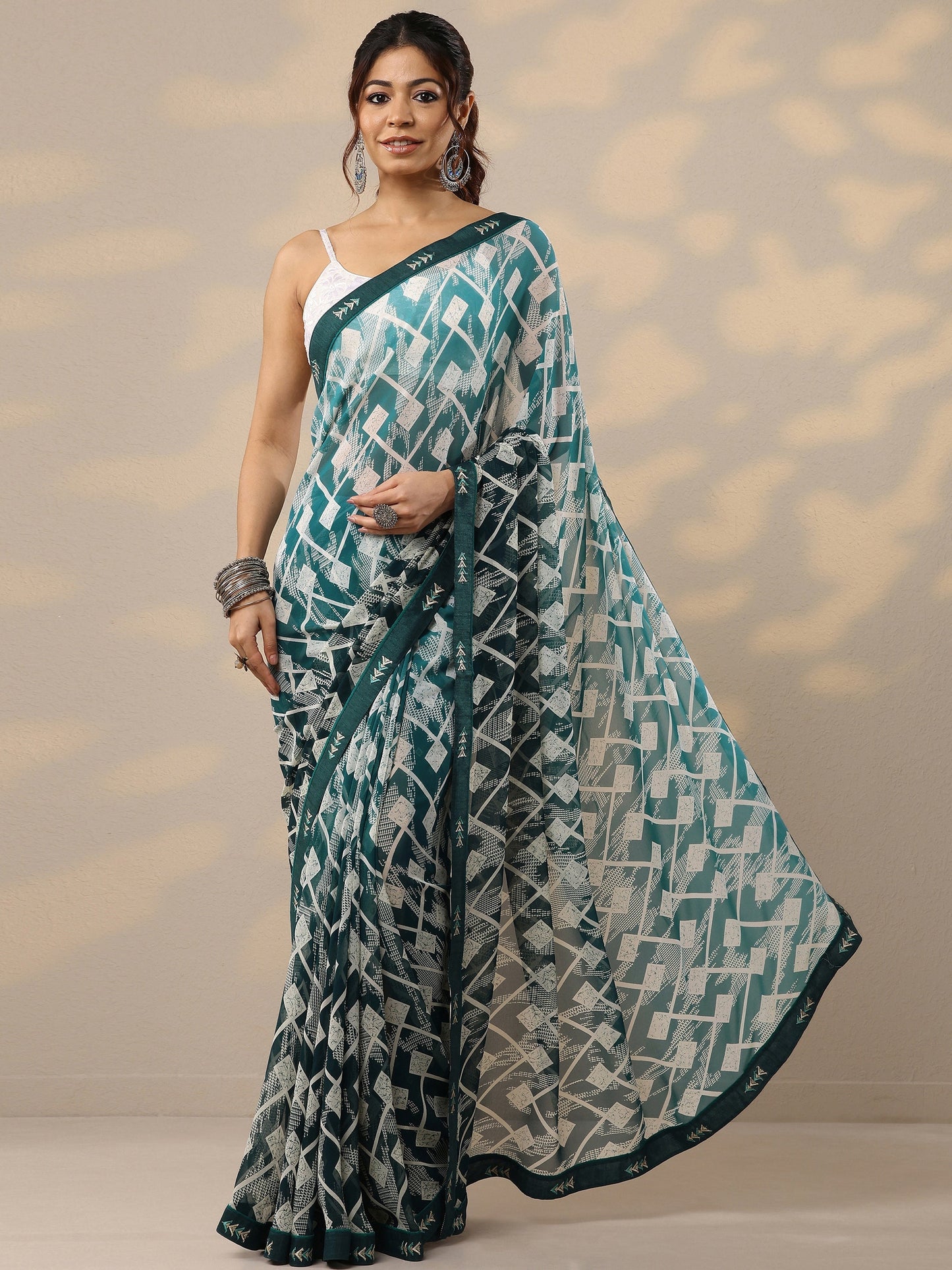 Teal Printed Georgette Sarees With Unstitched Blouse Piece