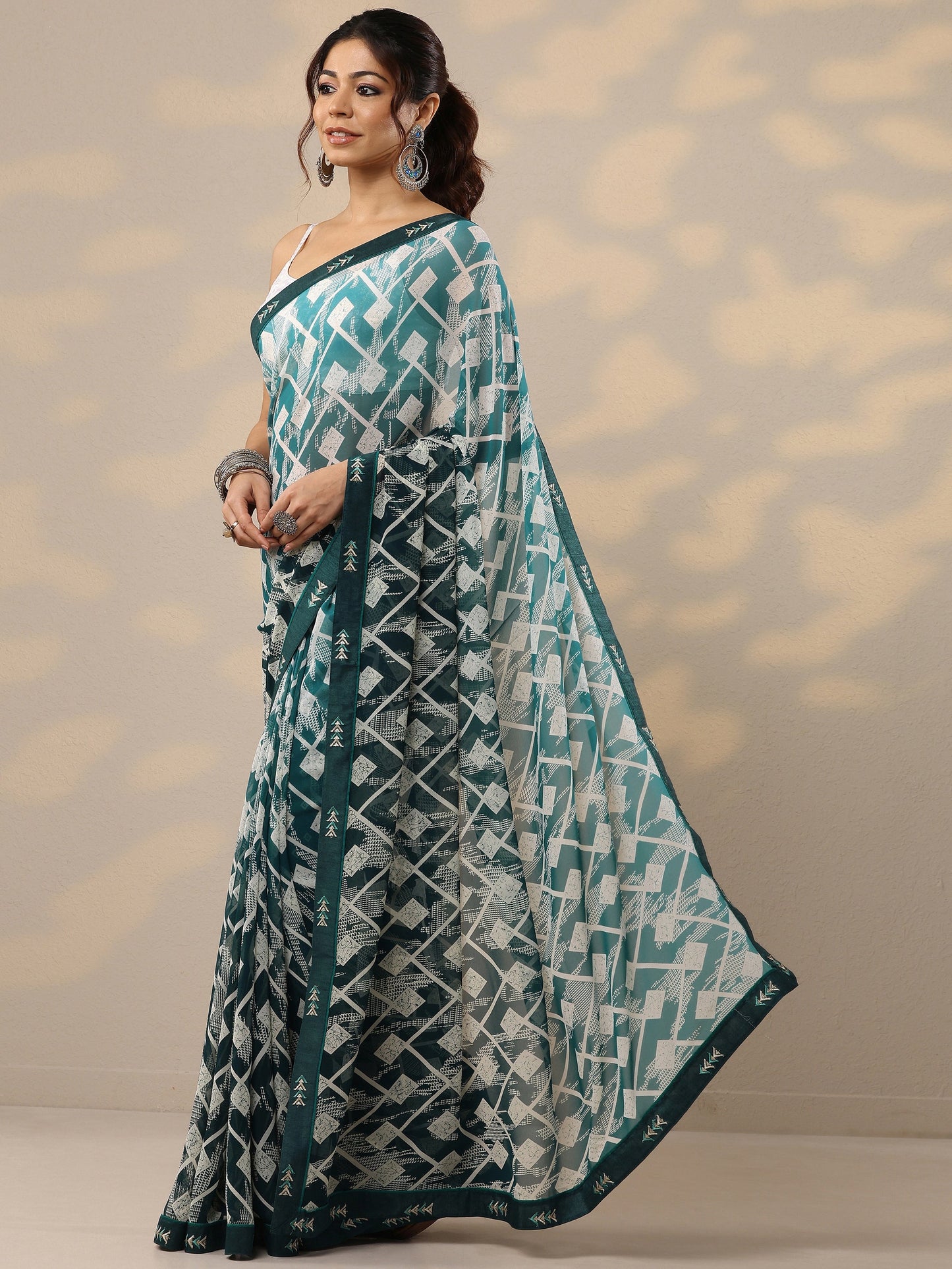 Teal Printed Georgette Sarees With Unstitched Blouse Piece