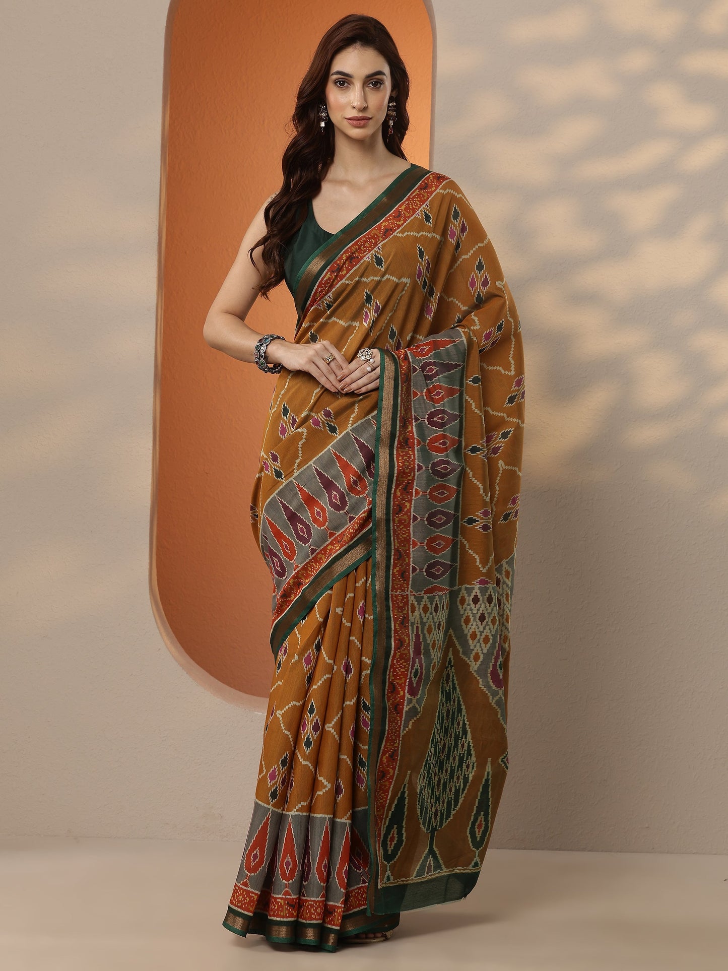 Mustard Ikkat Printed Silk Blend Saree With Unstitched Blouse Piece